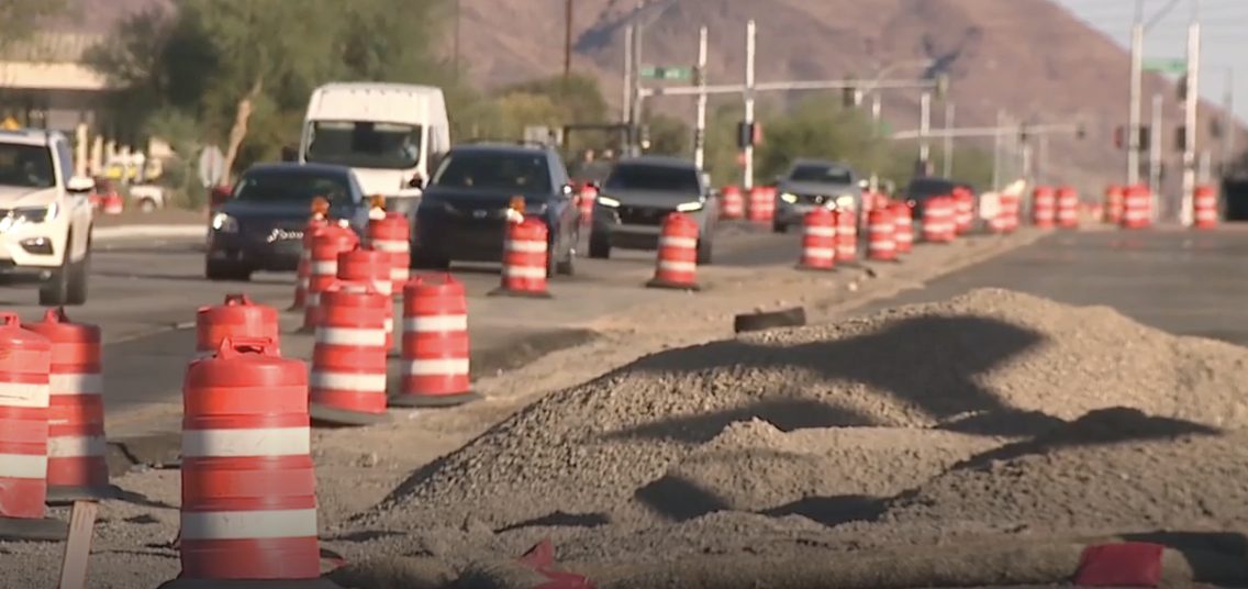Piles of loose soil within the barrel line immediately beside moving traffic